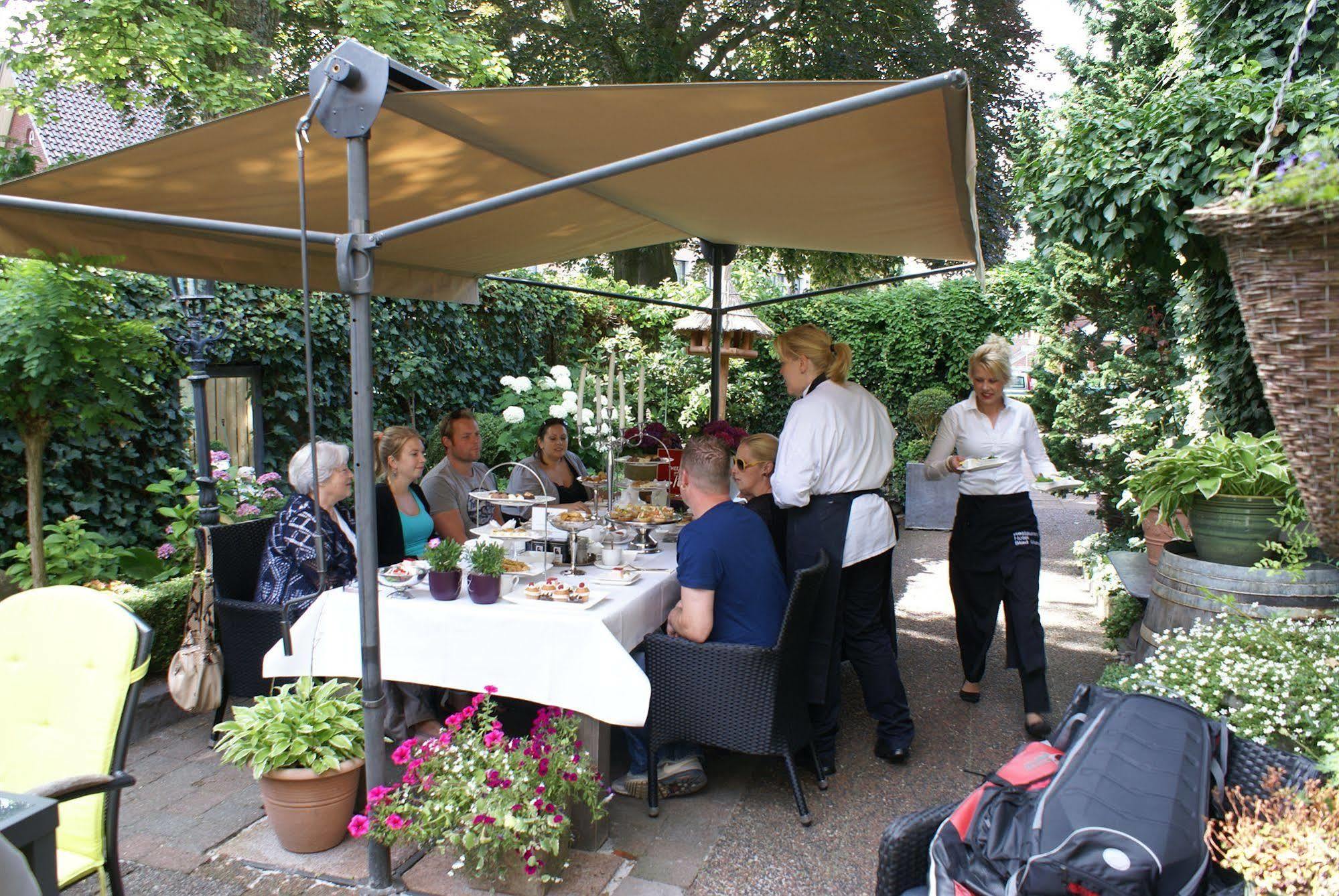 Hotel Restaurant Stad Munster فينترزفايك المظهر الخارجي الصورة The restaurant's garden